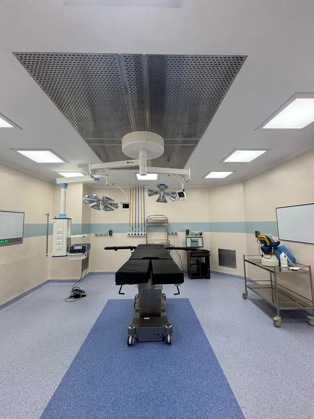 Modular operation theatre with laminar airflow ceiling, twin LED OT lights, surgeon pendant and antistatic vinyl floor, installed by UNISSI